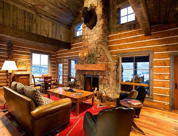Stacked stone fireplace in cozy cabins to get lost in | LovelySpaces.com